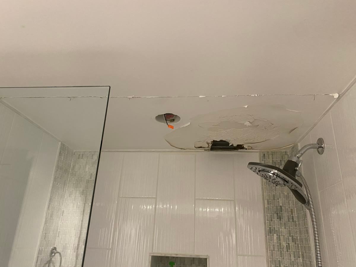 Before: hole in shower ceiling with exposed junction box