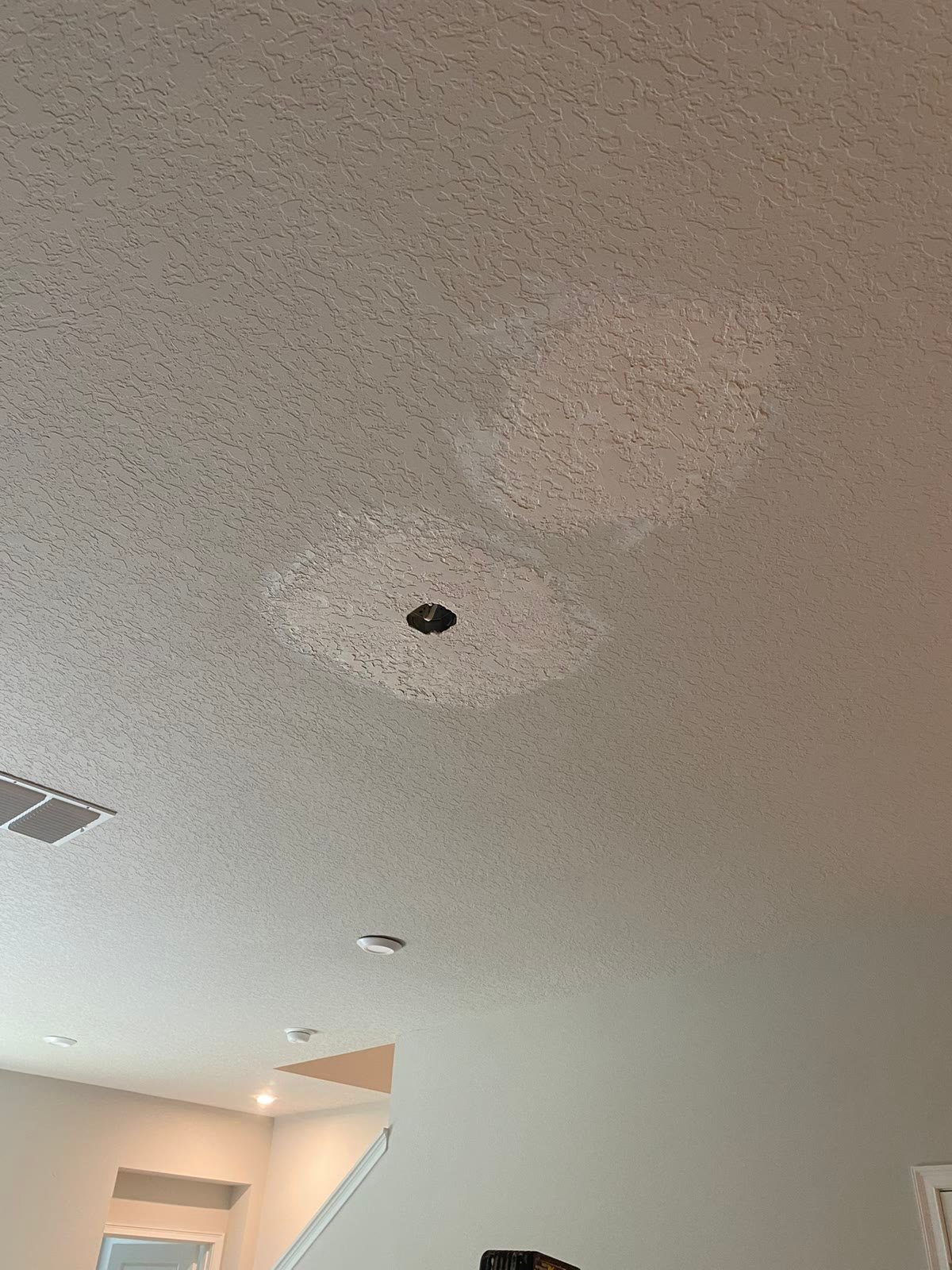 Ceiling patches texture matched to the surrounding ceiling